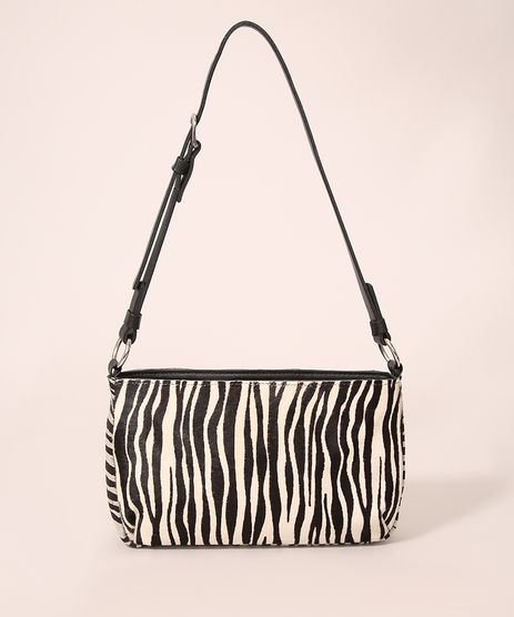 urban outfitters cow print bolsa