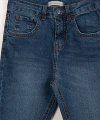Calça Skinny Jeans Teen com Rasgos Azul Médio detalhe  botão