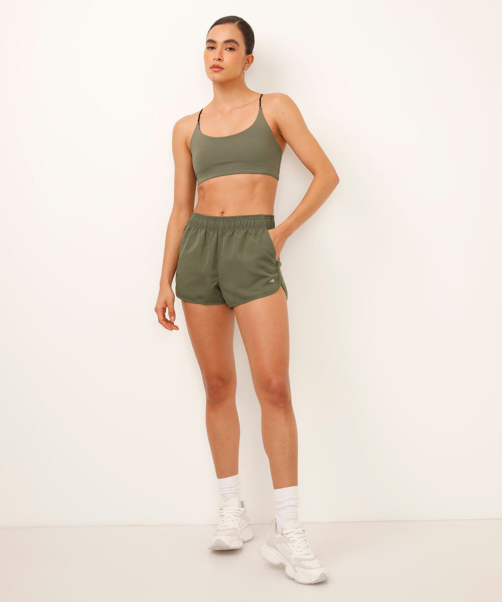 short running feminino com bolso esportivo verde