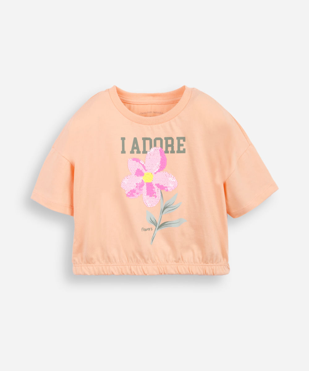 camiseta infantil barra elástico com aplicação de paetê de flor laranja