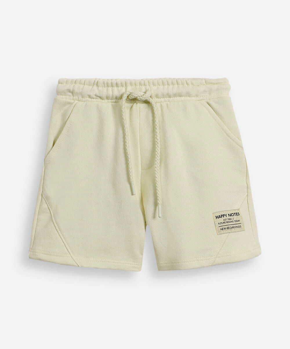 short infantil com recortes verde