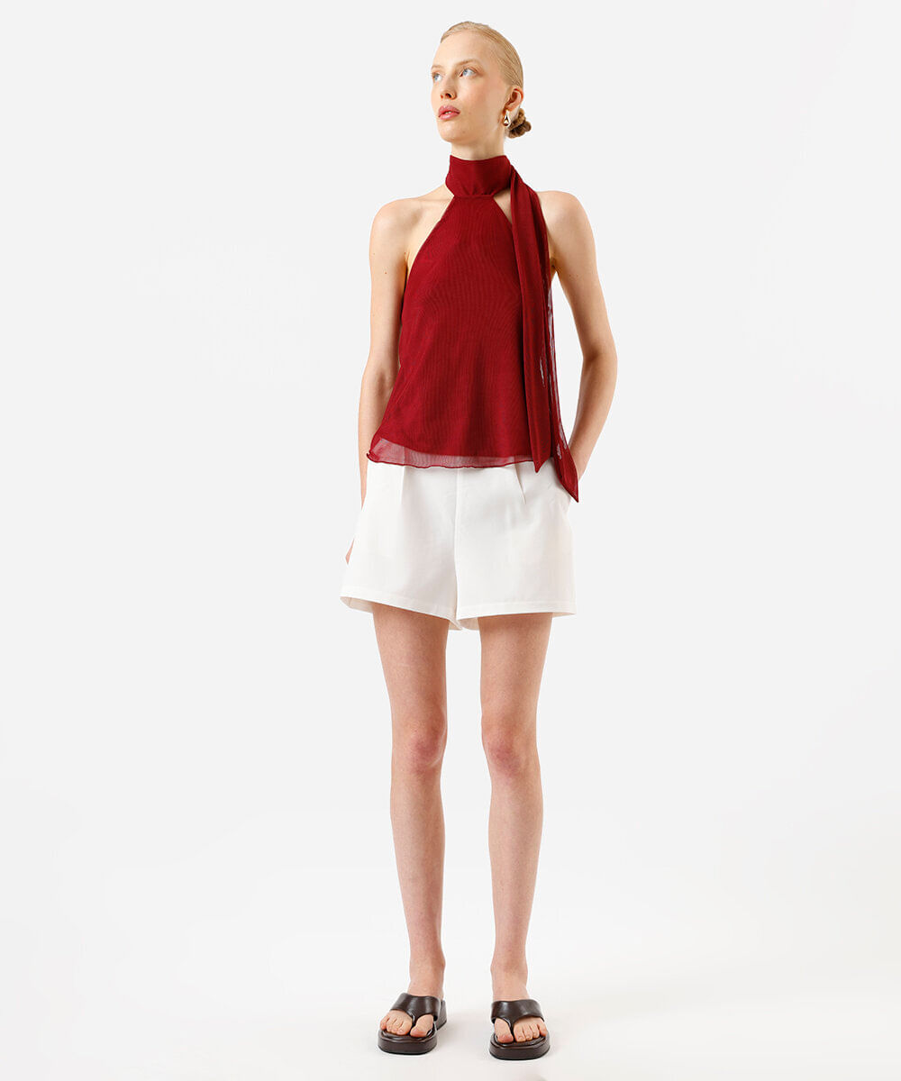 short feminino de alfaiataria com bolsos bege