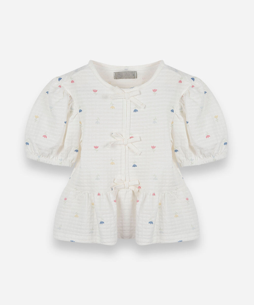 blusa infantil peplum de malha texturizada com laços e manga bufante off white